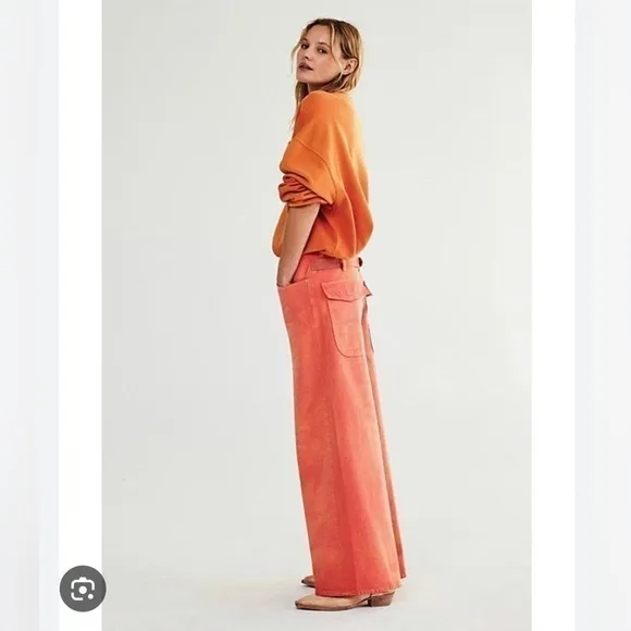 Free people waterfall orange baggy jeans Nwot size 24 /25 short