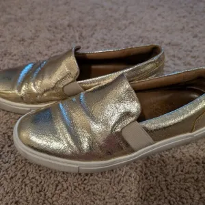 Frye Gold slipons size 5.5