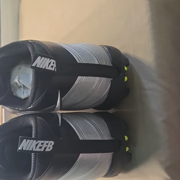 Nike Cleats. Men's Black and White Athletic Shoes