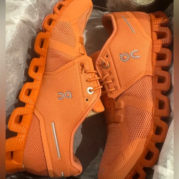 On Cloud Monocrome Shoes in Orange.