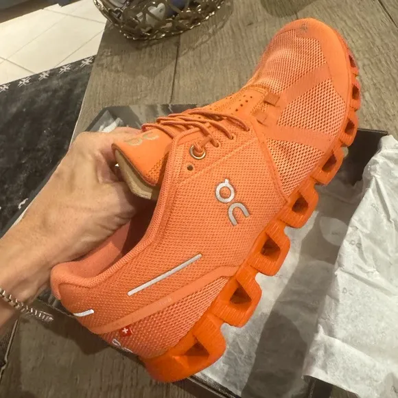 On Cloud Monocrome Shoes in Orange.