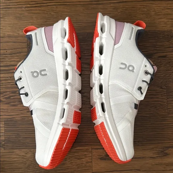 On Running White and Red Sneakers with CloudTec Comfort
