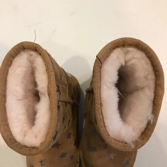 Ugg brown boots with stars.