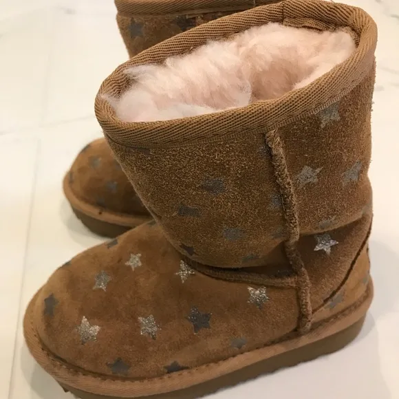 Ugg brown boots with stars.